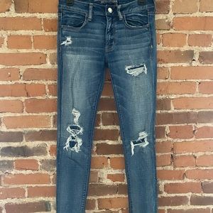 American Eagle ripped/patched begging a